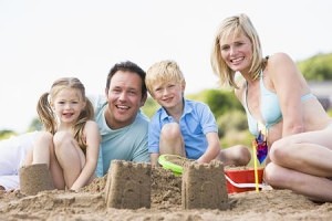 making sandcastles at the beach with family